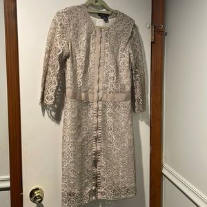 3/4 sleeve lace n metallic polyester lined jacket dress. 2 hidden slit pockets.